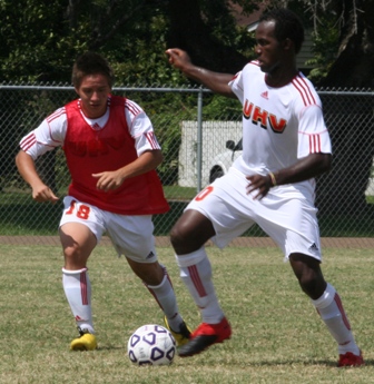 UHV's Walter Anoruo, right, battles UHV's Abel Farias for the ball during the Jaguars' Red and White scrimmage.